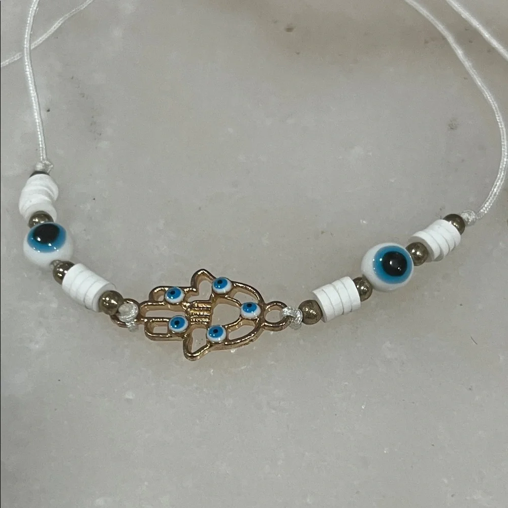 Chic Gold and White Hamsa Bracelet with Blue Accents
